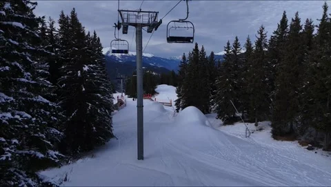 Meribel Ski Slope Low Flight Chairlift Pine Trees Aerial Drone Video 4K 動画素材 336288343