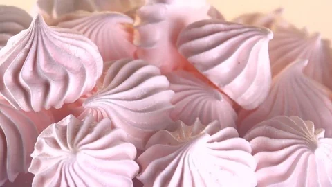 Meringue closeup. Rotation. Stockbeeldmateriaal 77479632