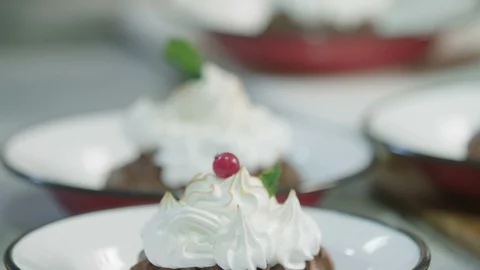 Meringue cookie being decorated with cranberries Stock Footage 129015851
