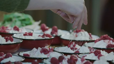 Meringue cookie being decorated in slow motion Stock Footage 129015905