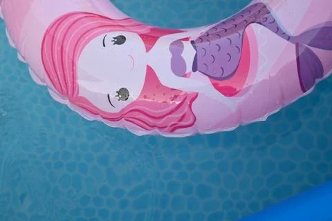 Mermaid pool float on blue water Stock Photos