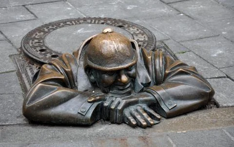 Merman statue on the sidewalk Stock Photos