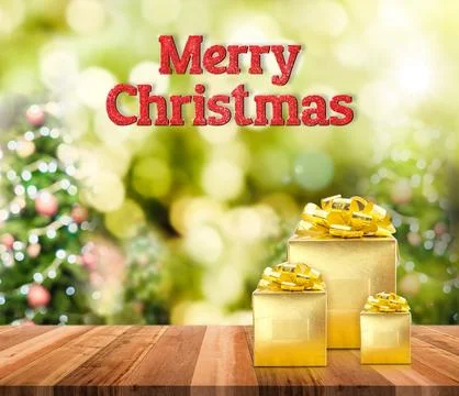 Merry Christmas (3d rendering) red glitter word and golden present on brown.. Stock Photos