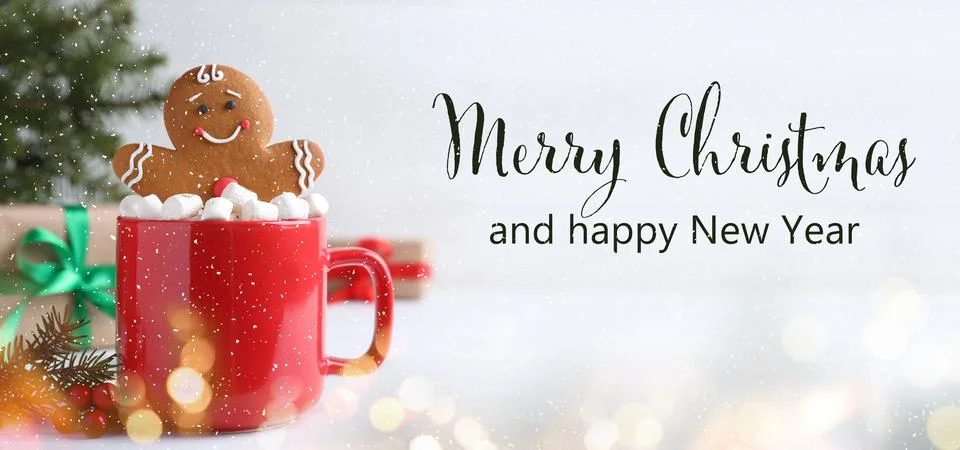 Merry Christmas and Happy New Year. Gingerbread man in red cup with marshmall Stock Photos