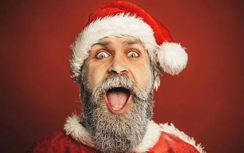 Merry Christmas and Happy New Year. Cheerful Santa Claus man in traditional w Stock Photos
