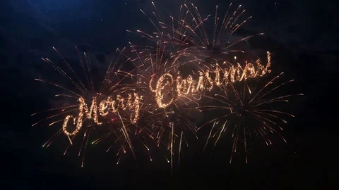 Merry Christmas greeting text with colored slow motion fireworks Stock Footage 70924962