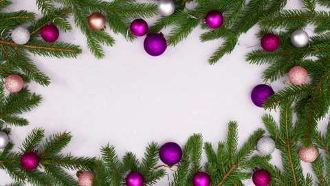 Merry Christmas text appear in frame with pine branch and ornaments. Stop motion 스톡 동영상 142915854