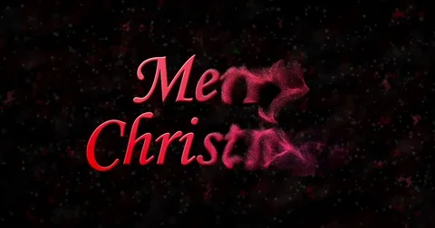 Merry Christmas text formed from dust and turns to dust horizontally on black Stock Footage 70287589