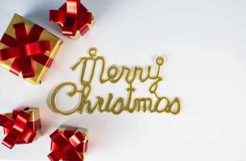 Merry Christmas text with gift boxes and decorations Stock Photos