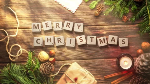 Merry Christmas Written with Falling Scrabble Tiles on a Wooden Table. Stock Footage 255123571