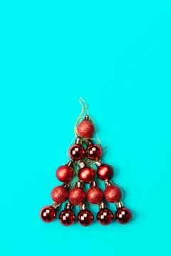 Merry creative Christmas tree made of red matte and glossy Christmas tree balls Photos