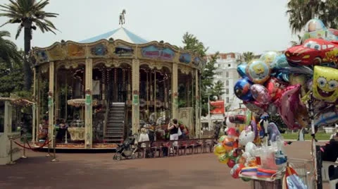 A merry-go-round Carousel in Cannes, France Vídeo Stock 15600983