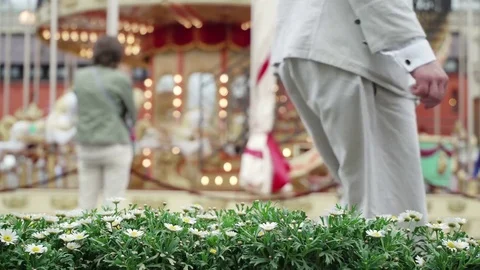 Merry-go-round carousel. Happy children run to carousel get best seats. Carousel Stock Footage 80736622