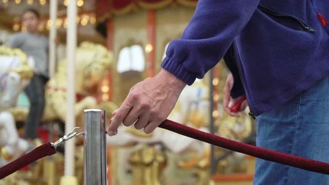 Merry-go-round carousel. Happy kids with parents riding carousel and taking Stock Footage 83715822