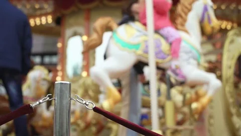 Merry-go-round carousel. Happy kids with parents riding carousel and taking Видео 84952387