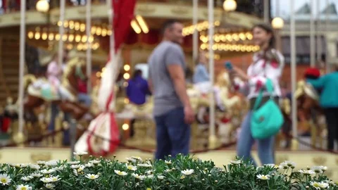 Merry-go-round carousel. Love young couple makes selfie in background of the Stock Footage 81604162