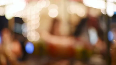 Merry go round carousel spinning at night. Stock Footage 137674793