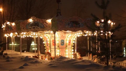 Merry-go-round carousel at winter night Stock Footage 71080943