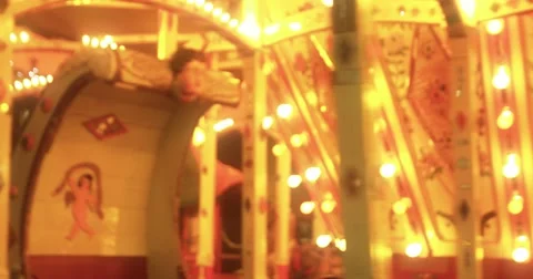 Merry go round lights up the night Vídeo Stock 57979302
