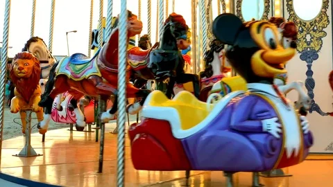 A merry-go-round, or crousel spinning at sunset. 库存影片 123865231