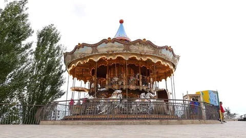 Merry-go-round slowly rotate around, Barcelona Stock Footage 99497828