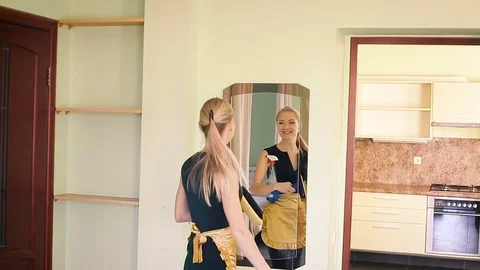 Merry maid cleans a mirror Video stock 82167003