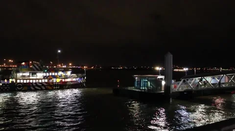 The Mersey Ferry pulling into the Pier Head landing stage at night Stock Footage 58812490