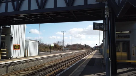 MerseyRail train arriving at a train station Stock Footage 126353554