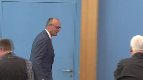 Merz criticizes that competitors like China subsidize products and undervalue th 스톡 동영상 339706447