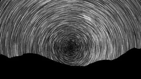 Mesa are seen in the foreground while stars create trails over time. Stock Footage 107856108
