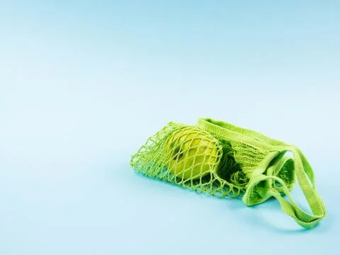 Mesh bag with green apple. Zero waste concept Stock Photos