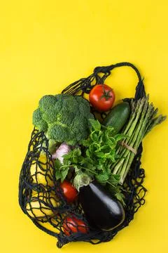 Mesh bag with vegetables. Zero waste, plastic free concept Stock Photos