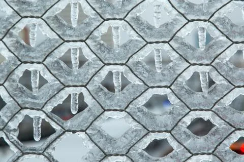 Mesh chain-link, which is very icy in winter. The honeycomb texture is Stock Photos