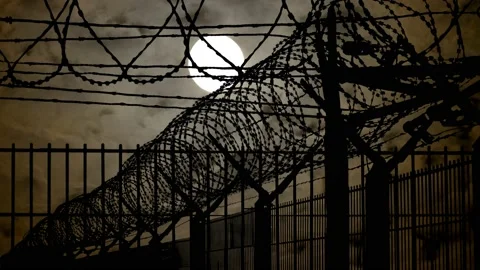 Mesh Steel and Barbed Wire, Time Lapse with Full Moon in Dark Atmosphere Stock Footage 145964150