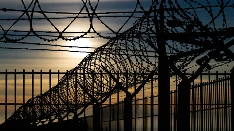 Mesh Steel and Barbed Wire, Time Lapse at Sunset Stock Footage 146069922