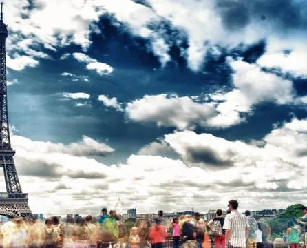 Mesmerized by Eiffel Tower, Paris. Moving tourists in Trocadero terrace Stock Photos