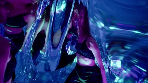 Mesmerized Woman Performing Dramatic Dance among Distorted Reflections Stock Footage 306982653