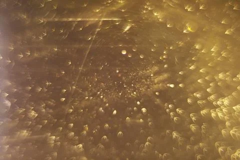 Mesmerizing Abstract Golden Light Patterns in Bokeh Effect Background Stock Photos