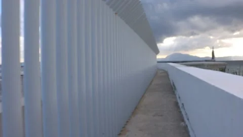 Mesmerizing  architecture white poles wall  handheld Stock Footage 238630012