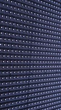 A mesmerizing array of illuminated pixels, textured dots black background Stock Photos