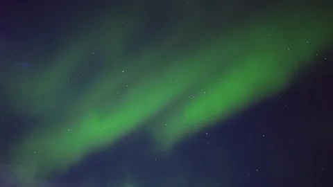 Mesmerizing Aurora Borealis Glows Across the Polar Sky in Brilliant Green Waves Stock Footage 308969972