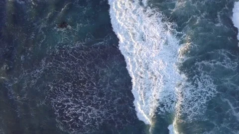 Mesmerizing chasing of waves that leads to cliffs Video stock 221375935