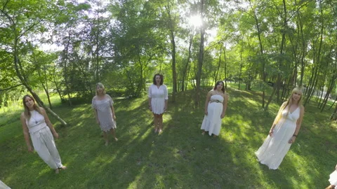 Mesmerizing Circle Dance in the Forest A Breathtaking Performance by 11 Women in Stock Footage 288339921