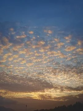 Mesmerizing Cloud Patterns at Sunset, A Captivating Display of Nature's Evening Stock Photos