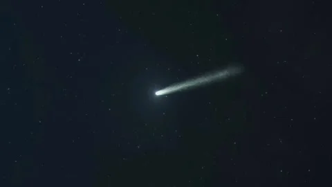 A mesmerizing comet streaks across the night sky. Stock Footage 292213909