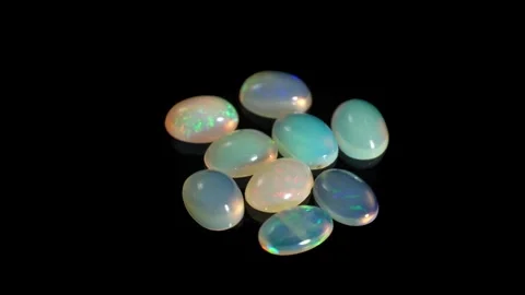 Mesmerizing Composition of Iridescent Opal Gemstones on a Black Background Stock Footage 285420181