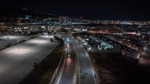 Mesmerizing drone hyper-lapse-timelapse of a bright street and roundabout Stock Footage 233765932