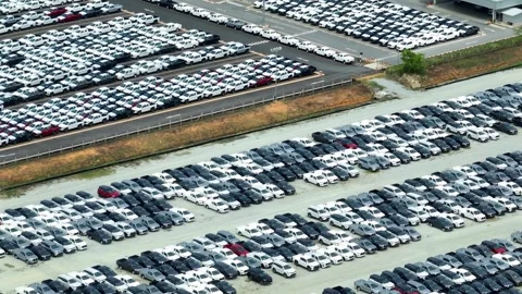 A mesmerizing drone's eye view captures a sea of cars parked. Stock Footage 249729868