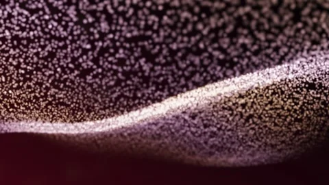 A mesmerizing field of shimmering particles moving in a gentle wave-like pattern Stock Footage 340535011