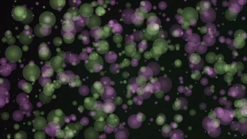 Mesmerizing green and purple bubbles float against a dark, abstract background Stock Footage 326709375
